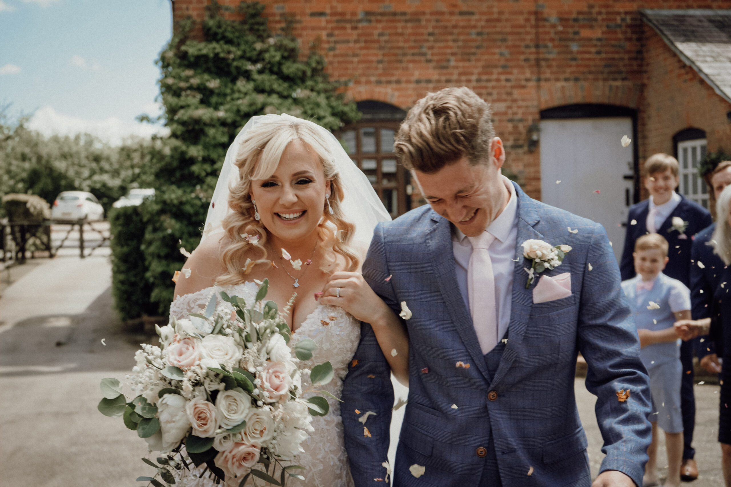 Newlyweds leaving church surrounded by guests, a moment covered by half day wedding photography