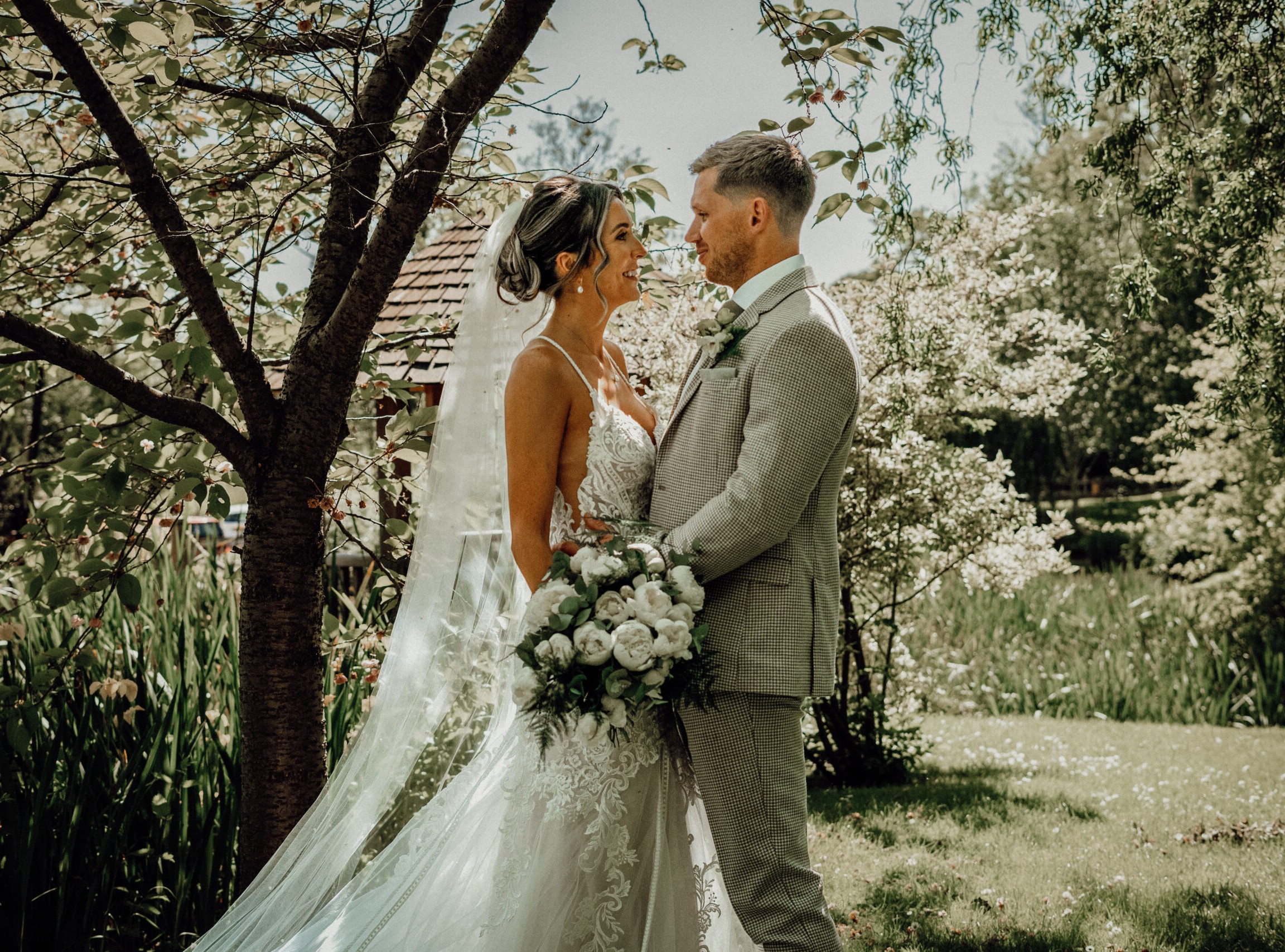 Bride and groom together in a woodland setting, the kind of moment to consider when deciding how to choose a wedding photographer