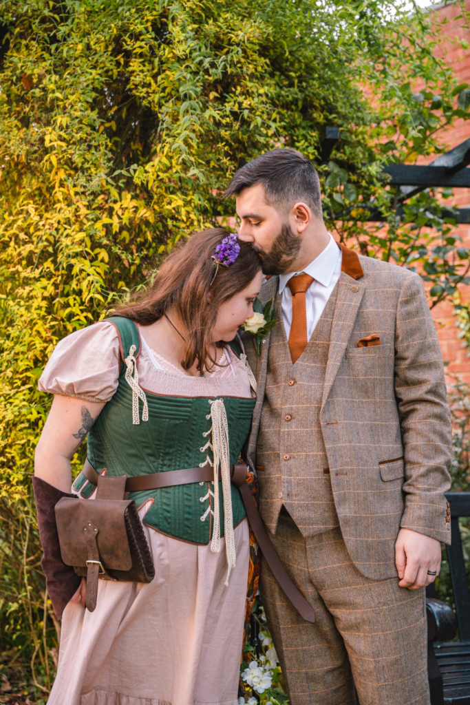 Couple laughing together in the garden, one of my favourite natural wedding photography poses