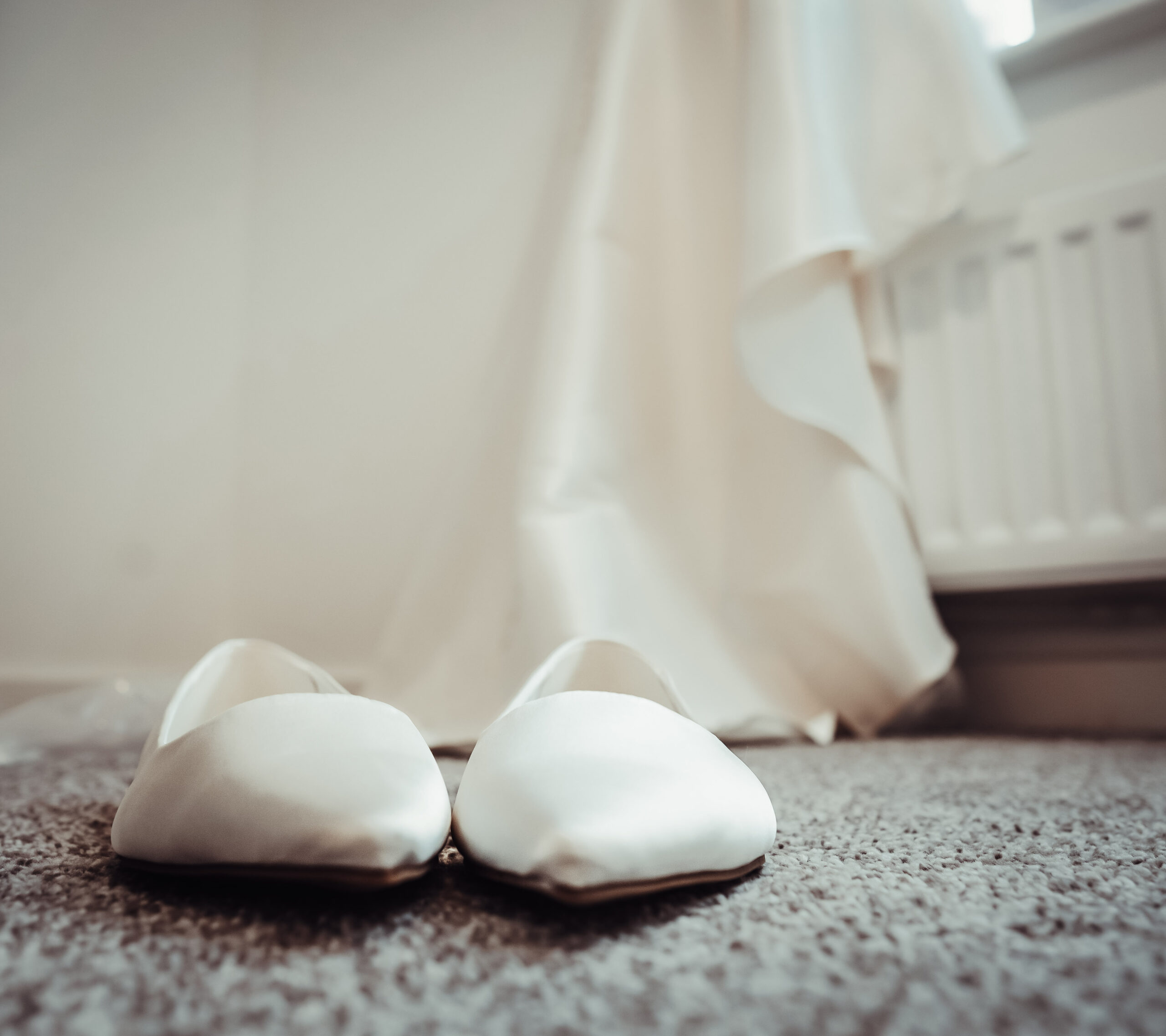 Close-up of bridal shoes on the morning of the wedding, a small detail worth capturing in Portchester Castle wedding photography