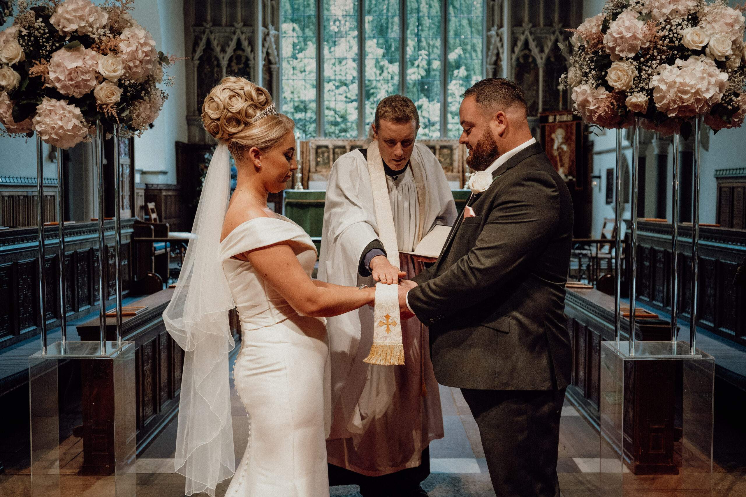 Bride and groom during their wedding ceremony, a key moment in registry office wedding photography