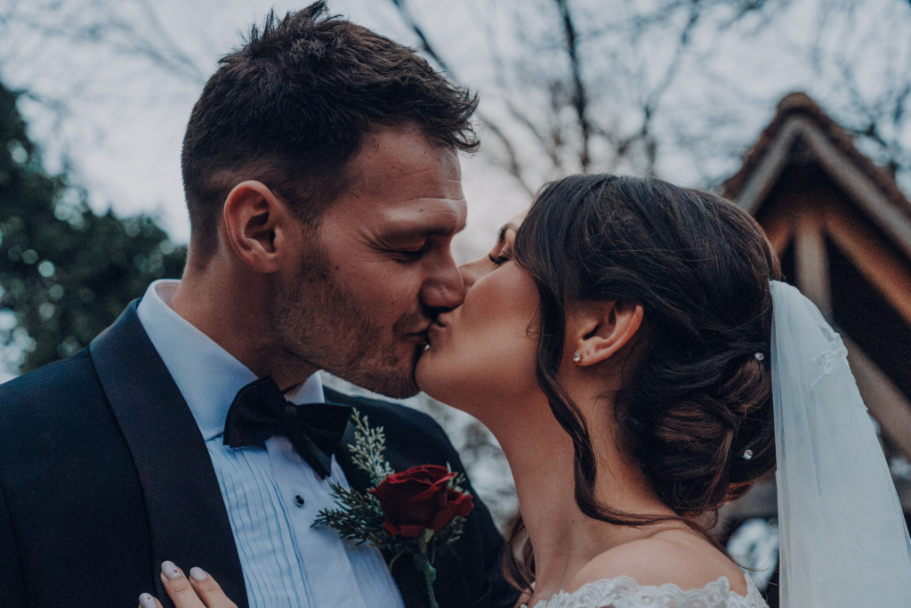 Close-up of the newlyweds sharing a kiss, Southsea Castle wedding detail inspiration