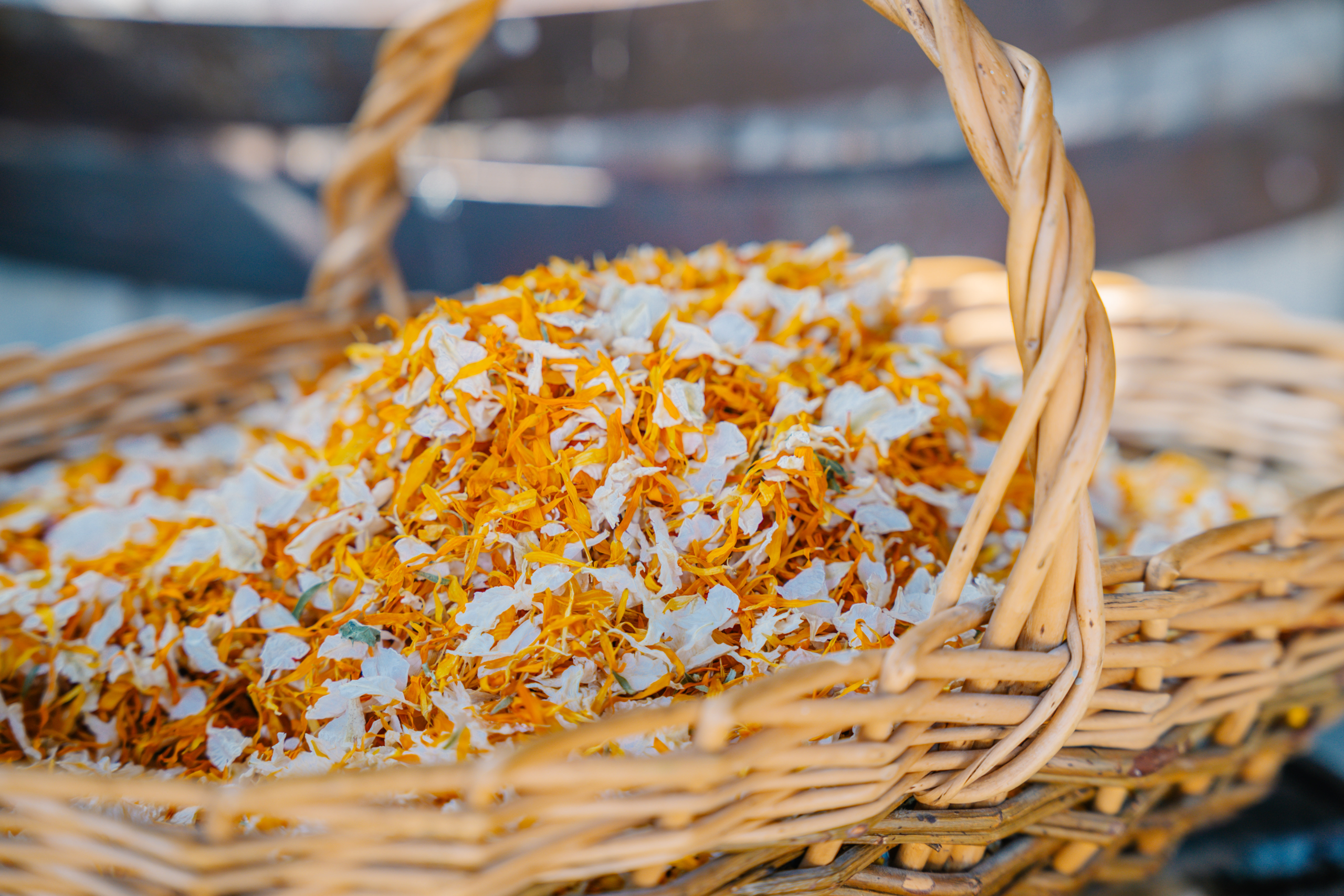 A basket of dried petal confetti at a New Forest wedding