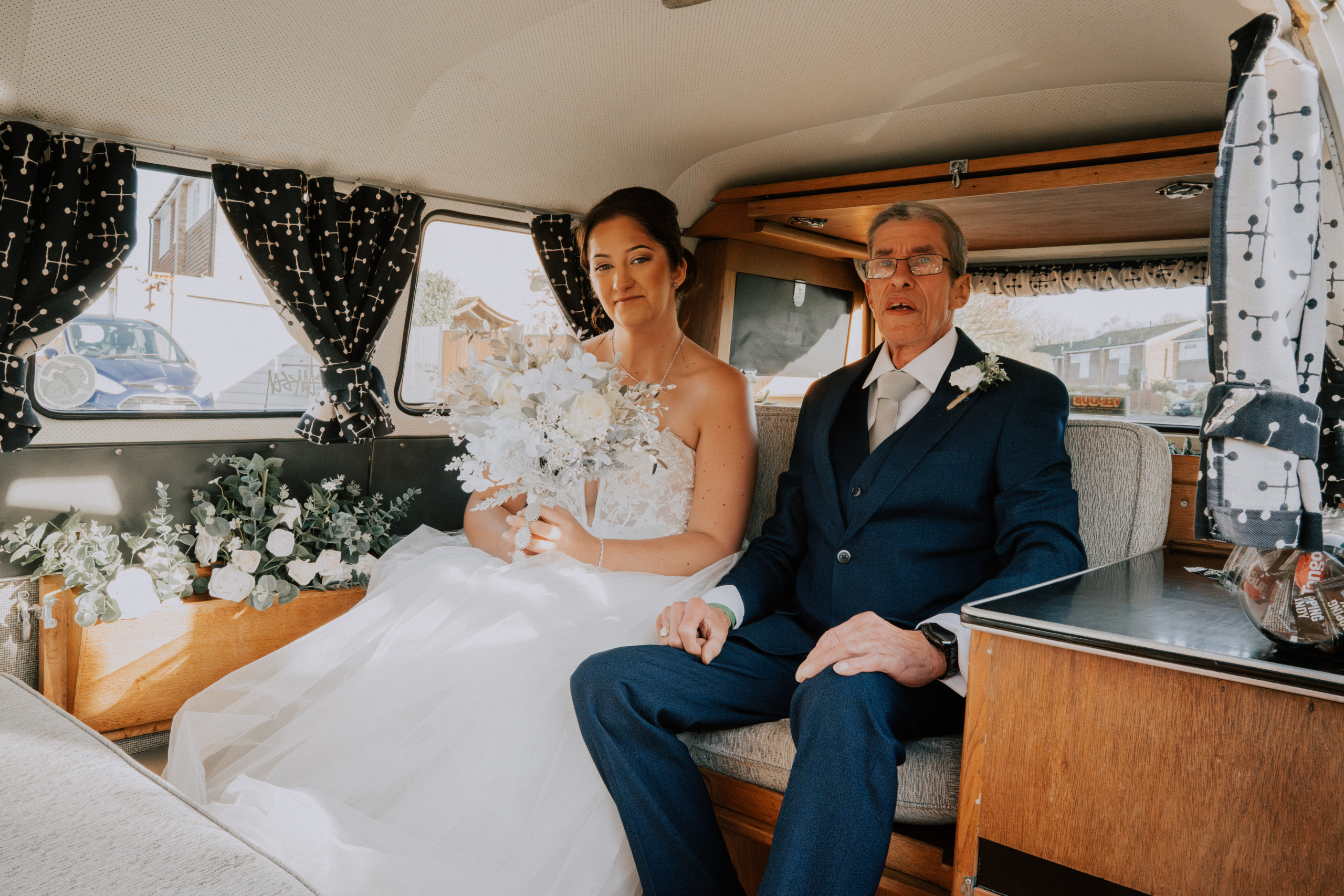 Wedding Content Creator Southampton 4 A bride and groom sitting together in their vintage wedding car