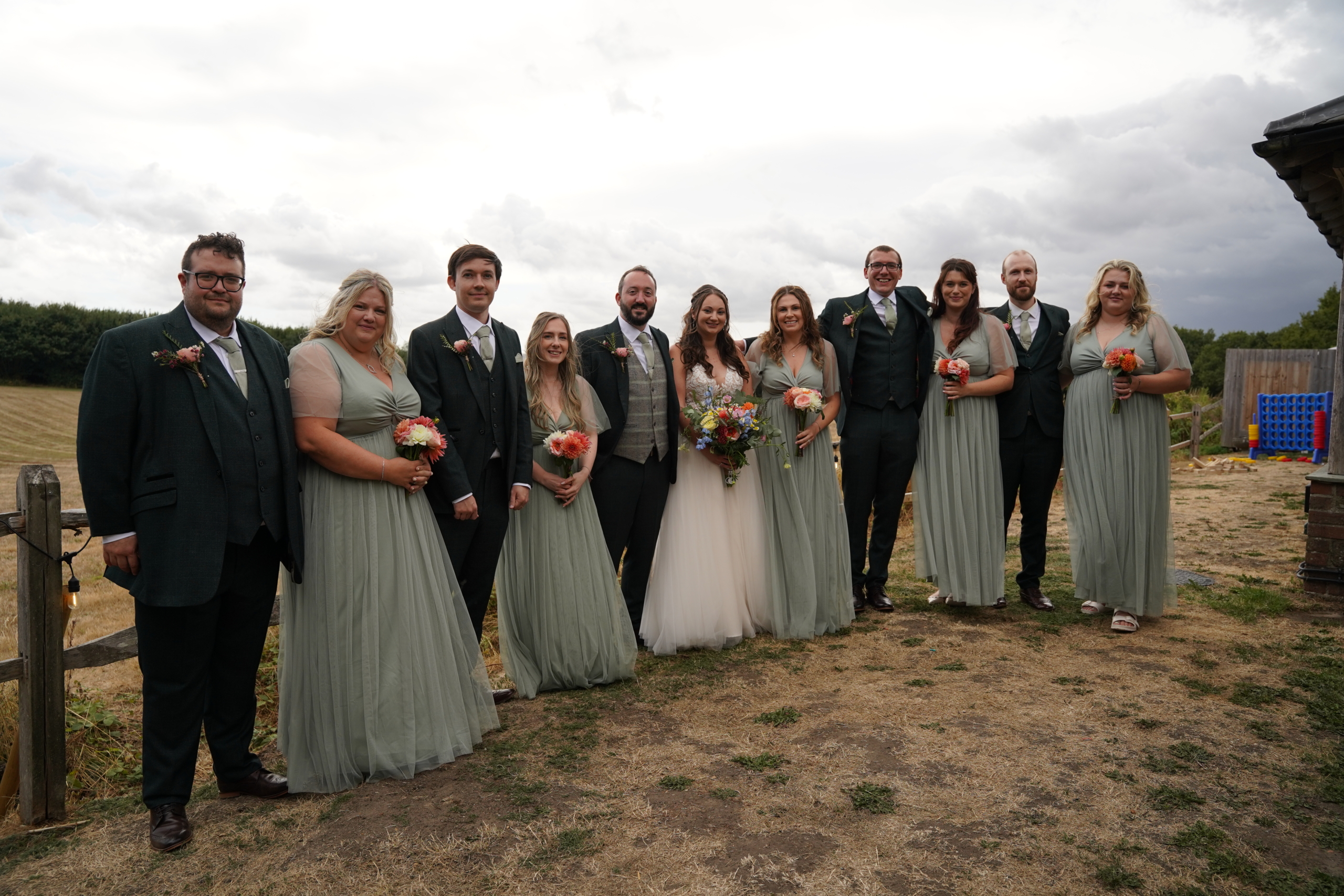 The bridal party lined up for a group photo at a Hampshire wedding