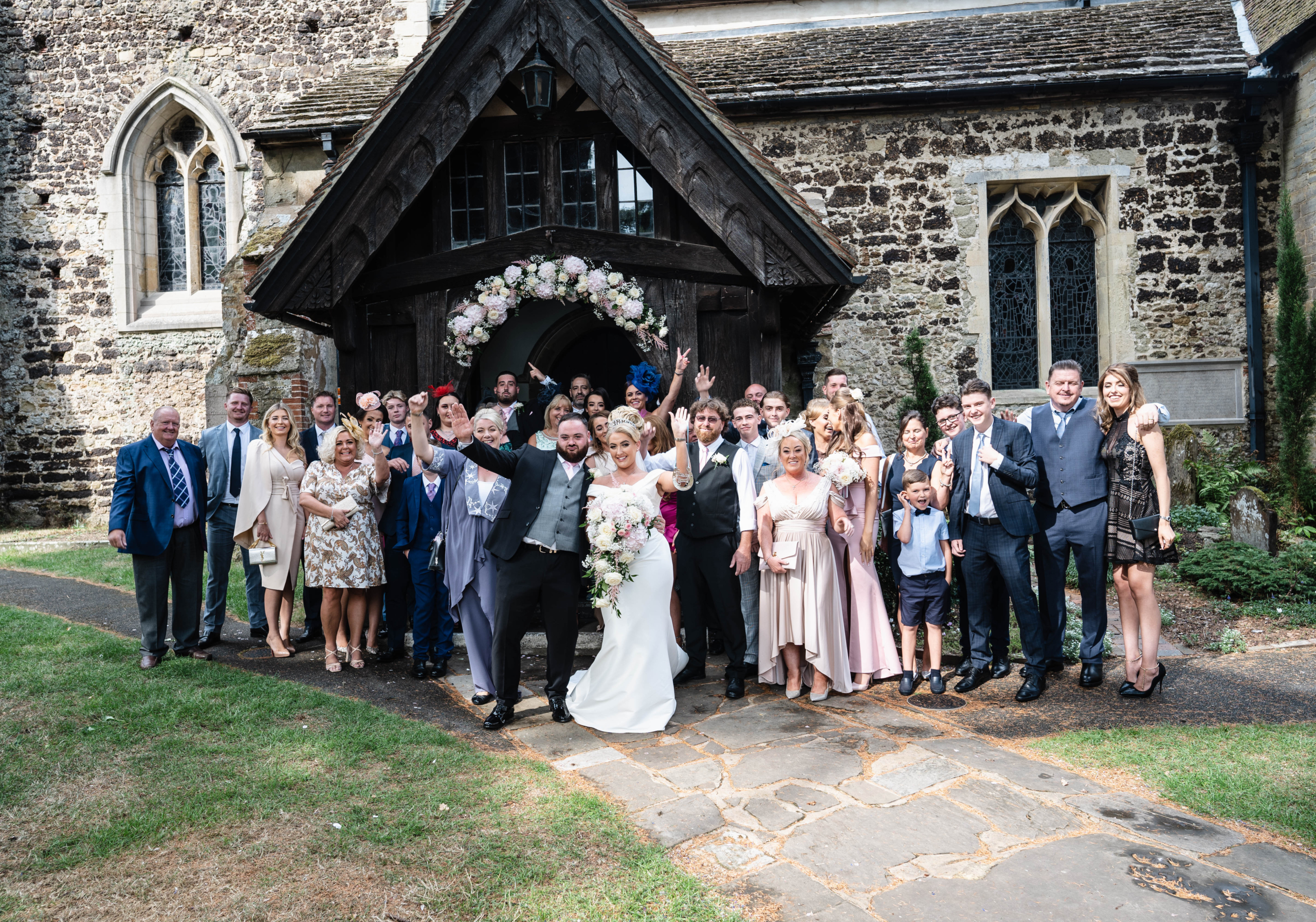 A large group photo outside a Hampshire church after the ceremony