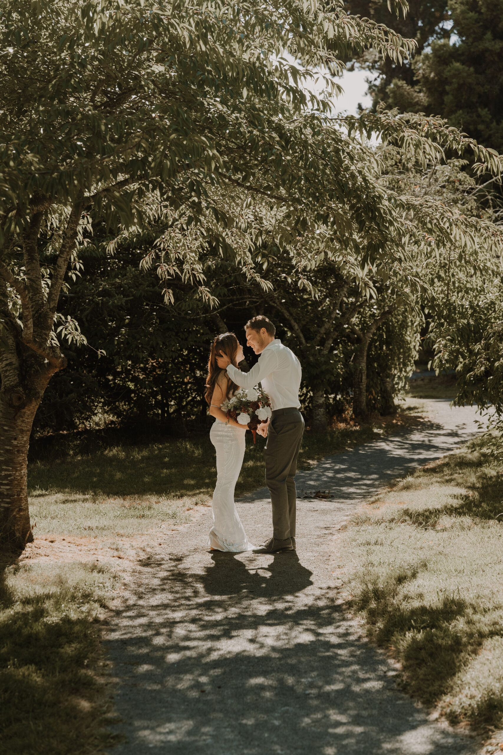 Couple embracing on a woodland path, photographed by a wedding photographer in Swanwick