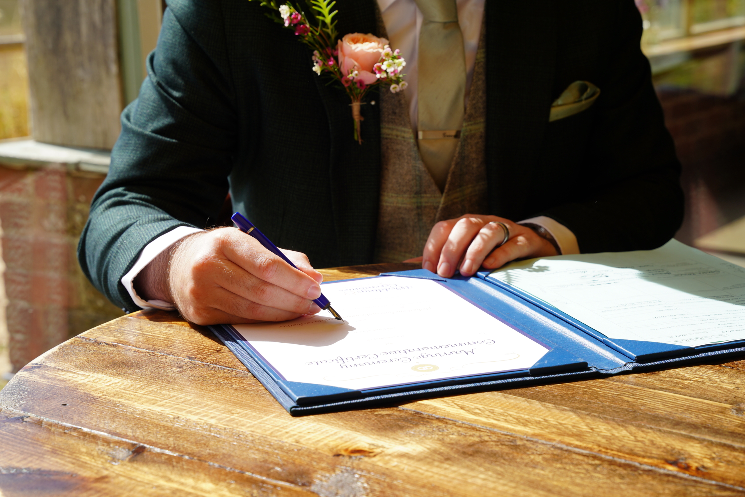 The groom signing the register at a Portsmouth wedding