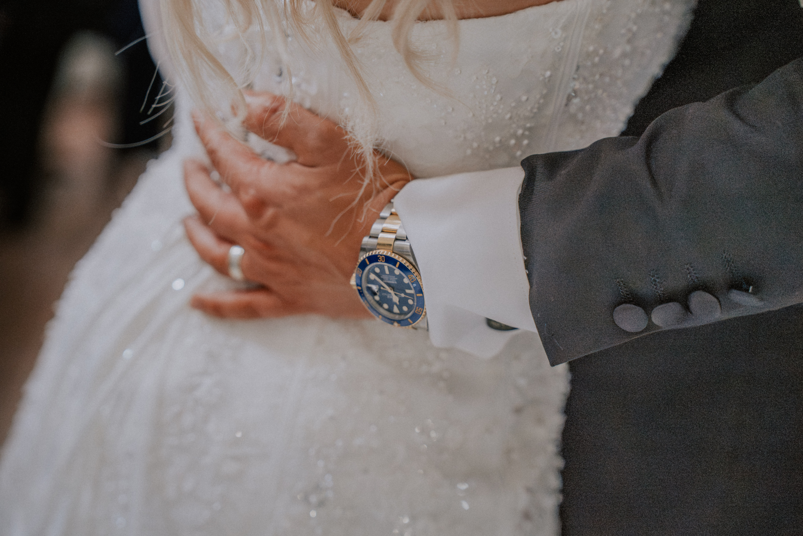 Wedding Videographer Southampton 5 A close embrace showing the groom’s watch against the lace wedding dress